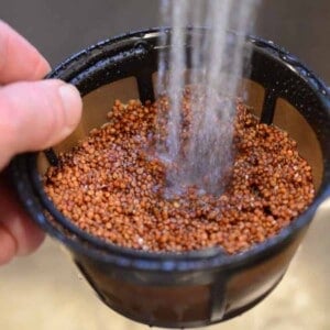 rinsing quinoa in a coffee filter.