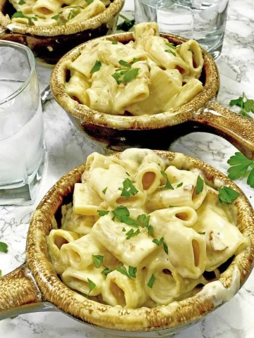 2 crocks mac and cheese on table