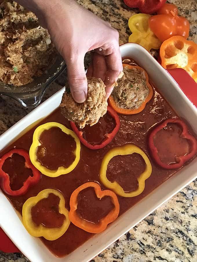 A pan of food, with Stuffed peppers and Bell pepper