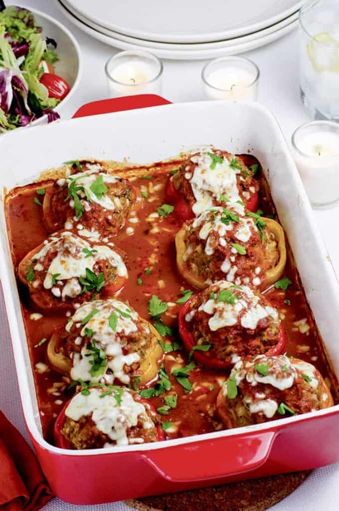 Baking pan of baked stuffed peppers.