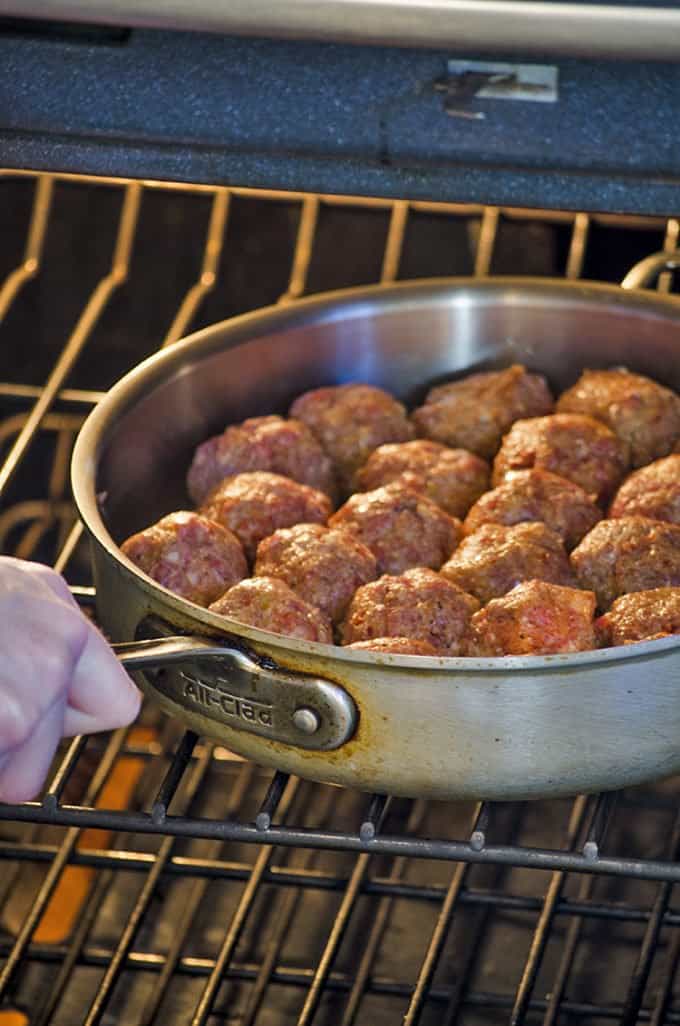 Transfer the cheese stuffed beatballs to a hot oven to finish baking.