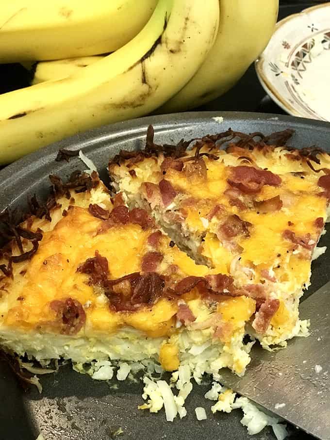 2 slice of quiche in pan in front of bananas