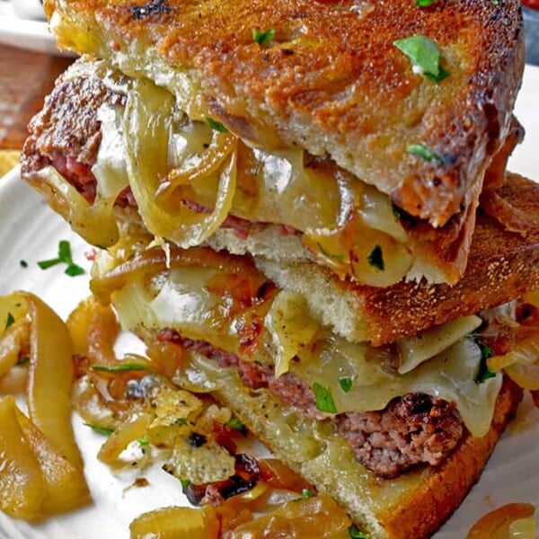 Close up of cut, stacked, grilled patty melt