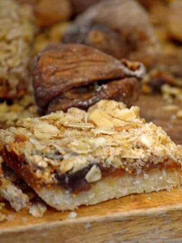 Close up of fig bars on board with whole figs