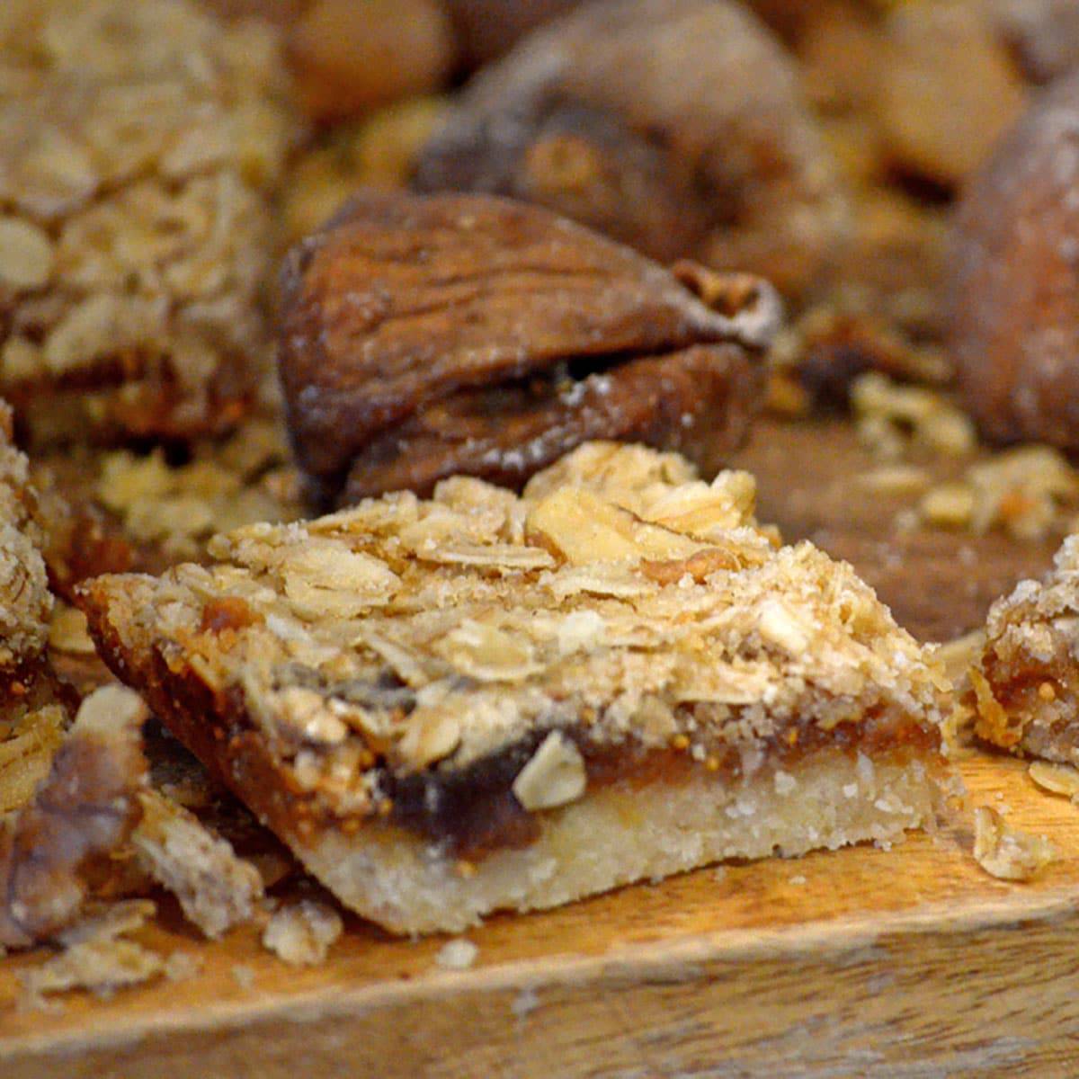 Close up of fig bars on board with whole figs
