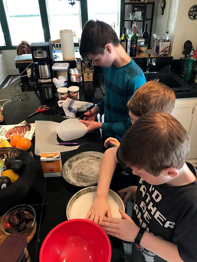 A bunch of kids in a kitchen
