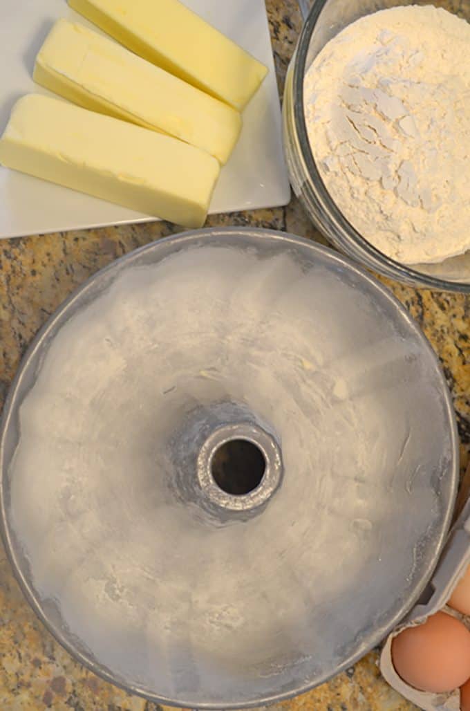 Greased and floured bundt cake pan with butter and flour.