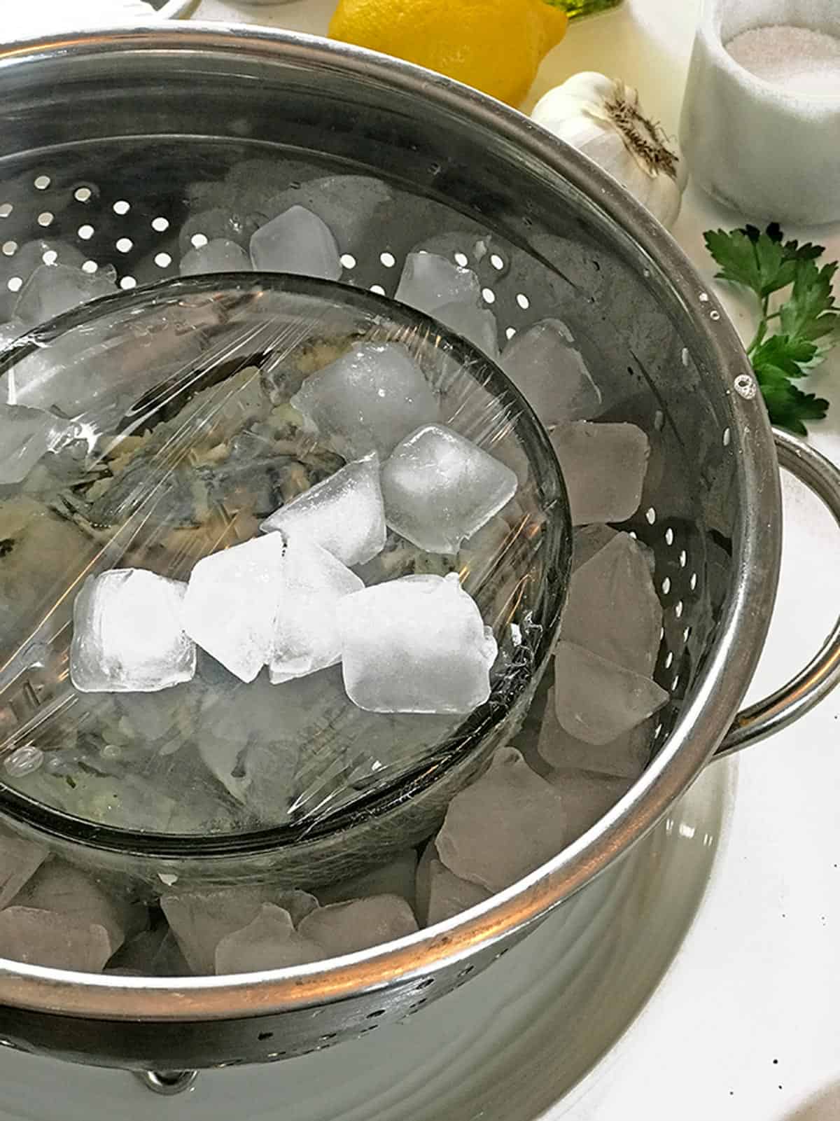 A bowl of shrimp sitting on ice.