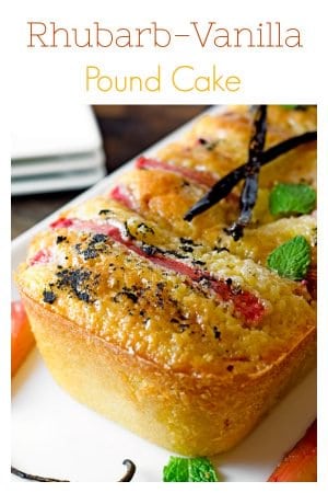 Close up of pound cake showing rhubarb vanilla beans and mint atop