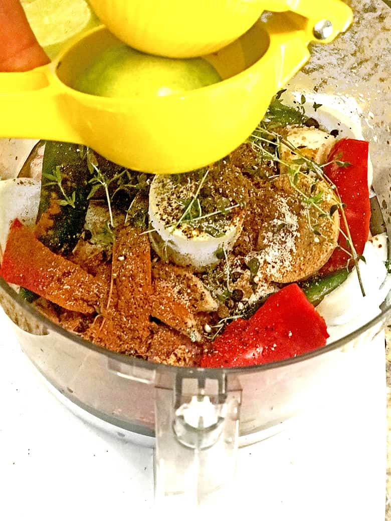 Food processor containing spies,herbs and vegetables