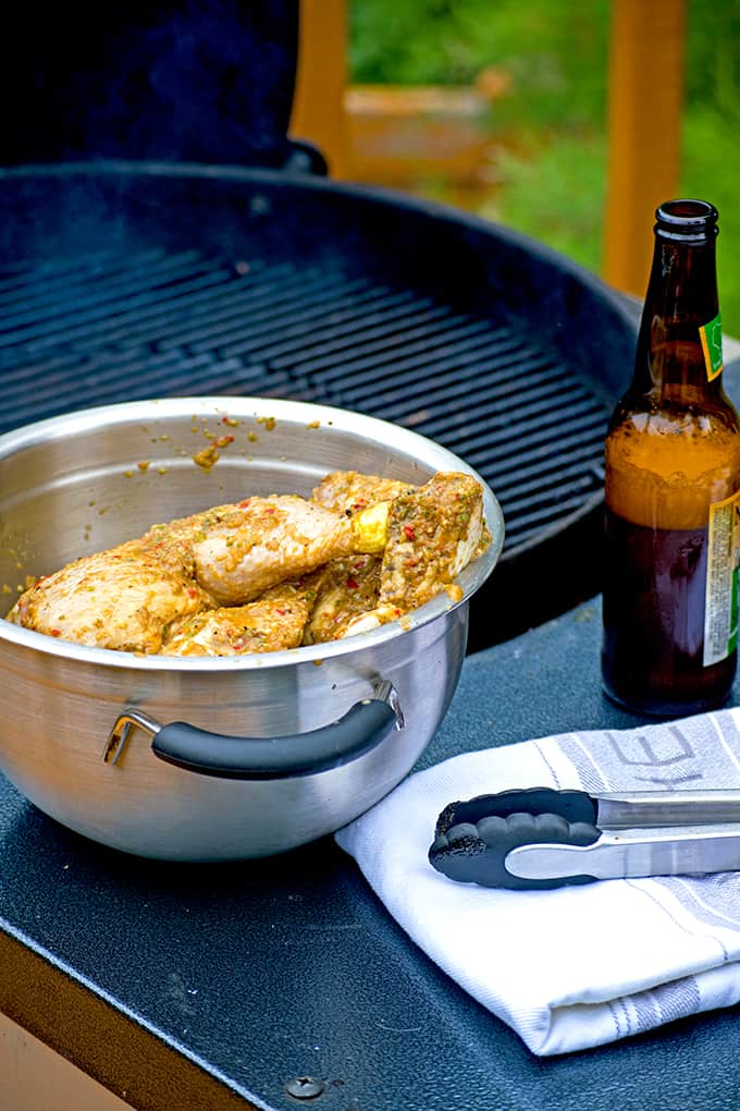 Heating a charcoal grill for jerk chicken.