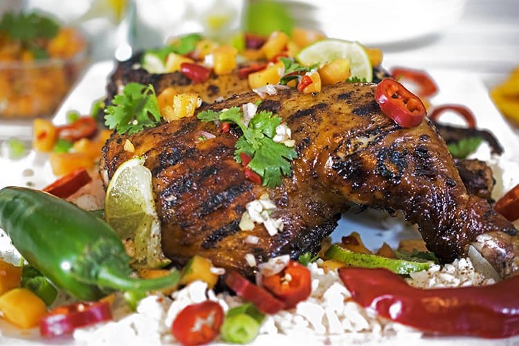 Serve this jerk chicken with white rice and papaya salsa.
