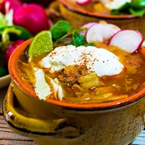 Sour cream and lime wedges add extra flavor to this posole recipe.