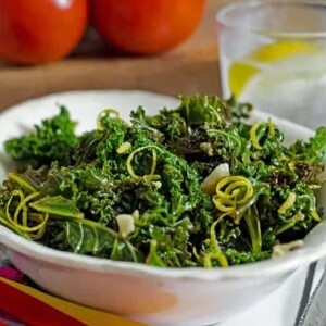 This steamed kale recipe for platter talk food blog features fresh lemon juice and zest, garlic, and crushed red pepper.