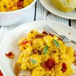 Pumpkin gnocchi a in serving bowl and on plate with fork