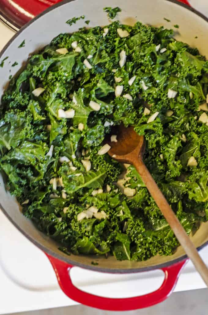 Galic is added to steamed kale after the kale is wilted.