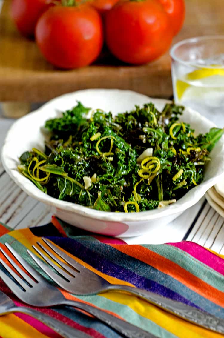 A bowl of food on a table, with Kale and Salad
