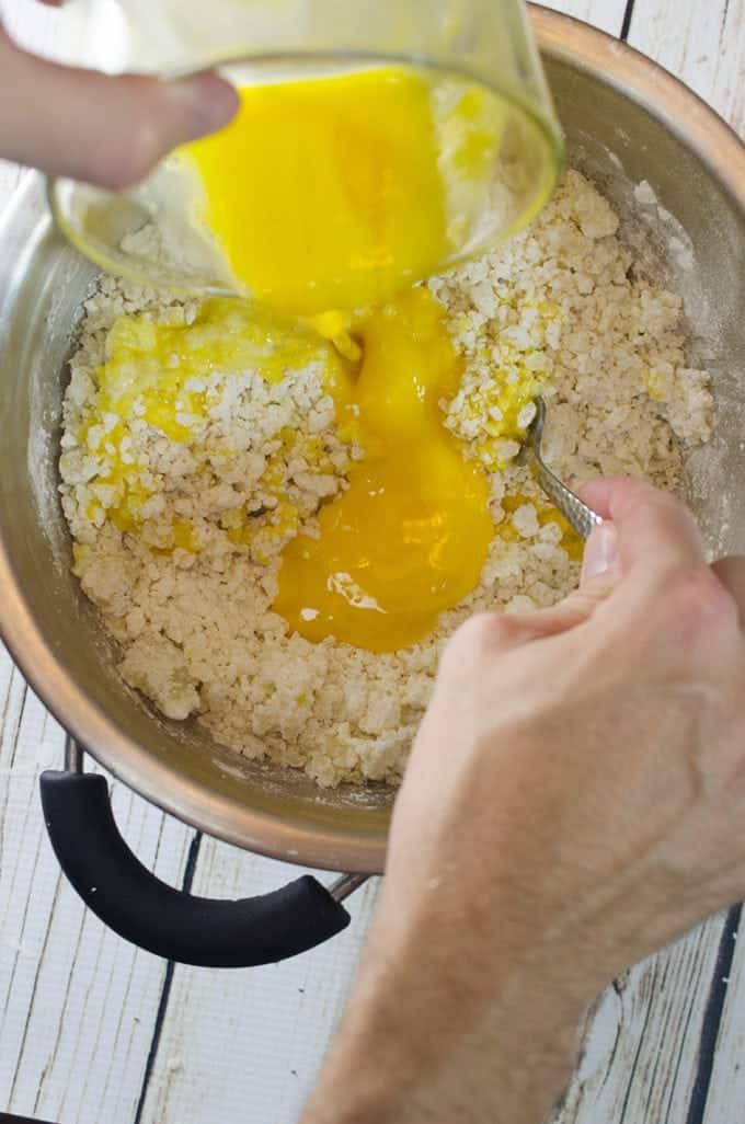 Mixing ingredients for potato dumplings.