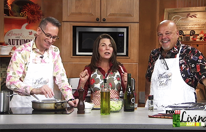 People in kitchen demonstrating cooking and preparation with ingredients at stove and counter 