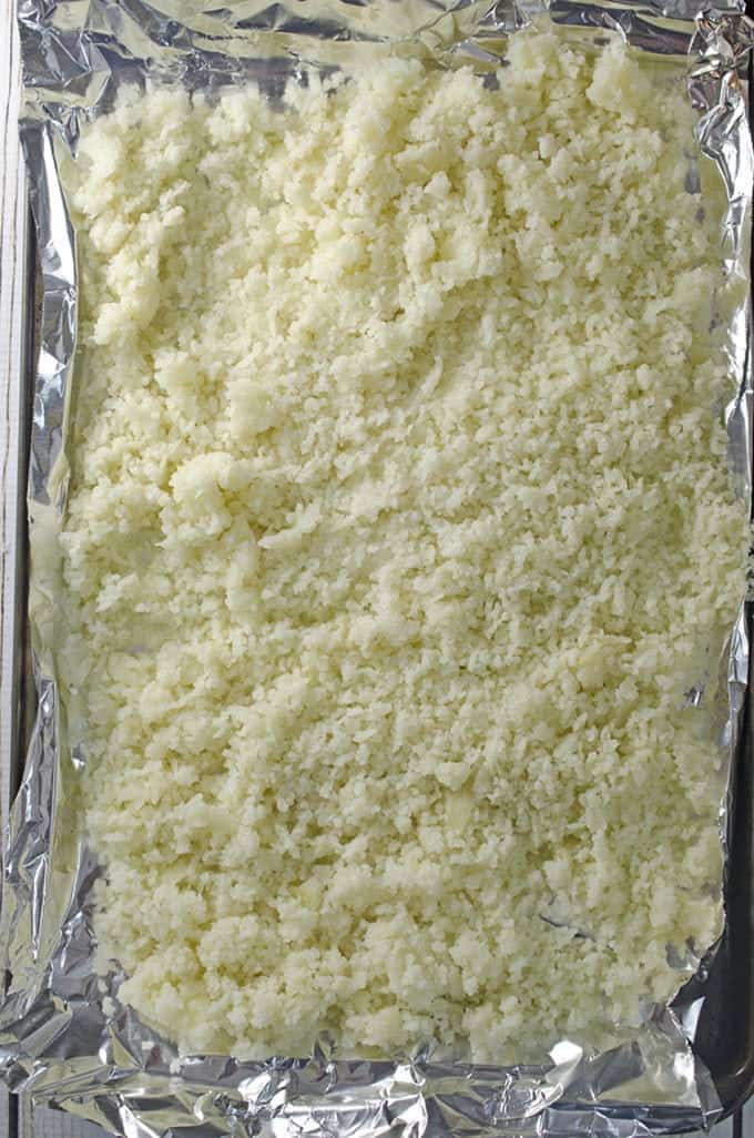 Making potatoe dumplings out of riced potatoes.