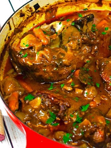 Pork vegetable stew in cooking vessel