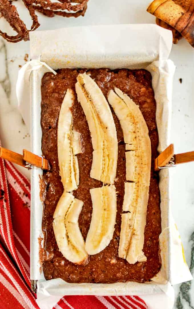 Top this chocolate banana bread with a sliced banana.