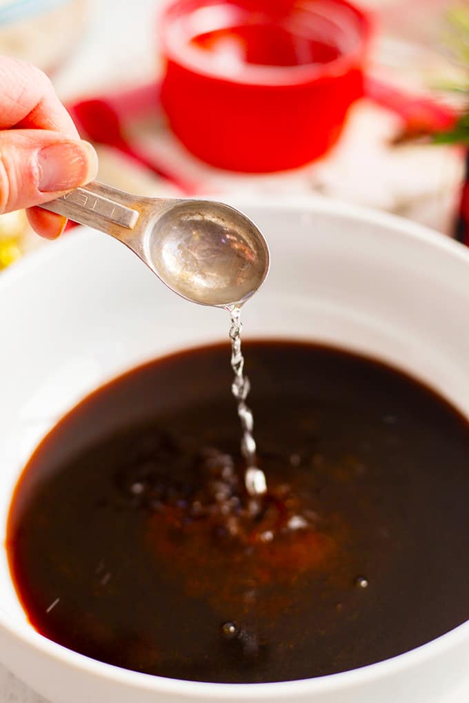 Adding ingredients to a mixing bowl