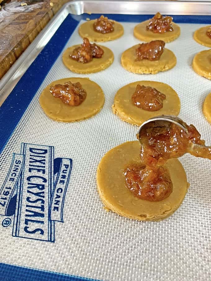 Adding date filling to cookies on a baking sheet