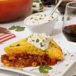 A slice of chili cornbread casserole on a plate.