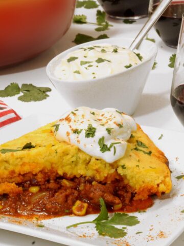 A slice of chili cornbread casserole on a plate.