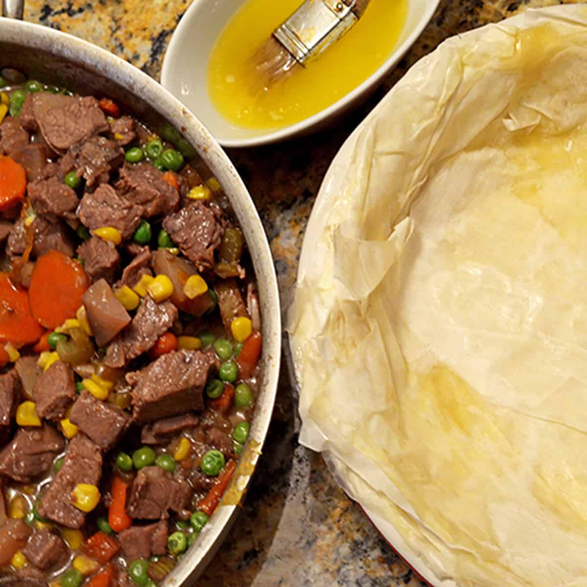 A pan of meat and a phyllo dough.