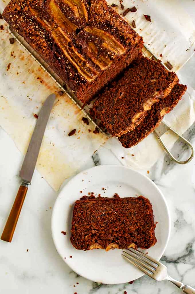 A piece of chocolate banana bread on a plate.