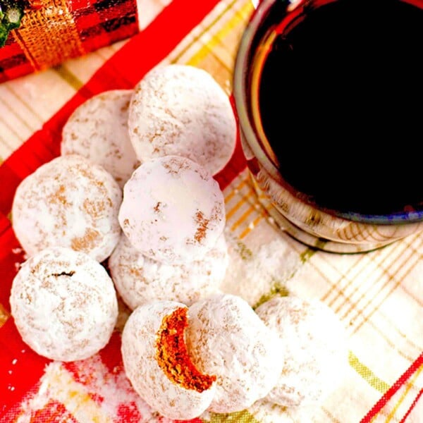 Pile of Pfeffernusse cookies with coffee