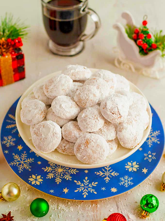 A plate of white Christmas cookies