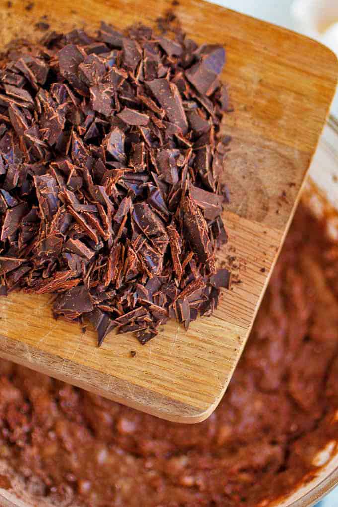 A cutting board with shaved chocolate.