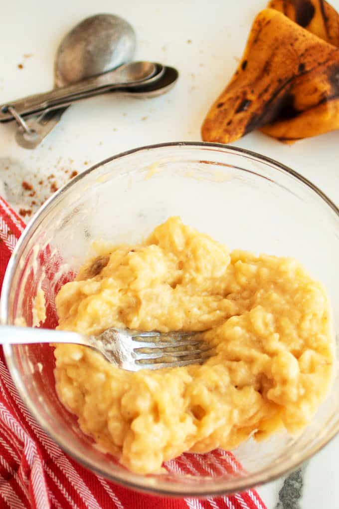 Mashing a bowl of bananas