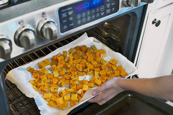 Food cooking in an oven, with Butternut squash