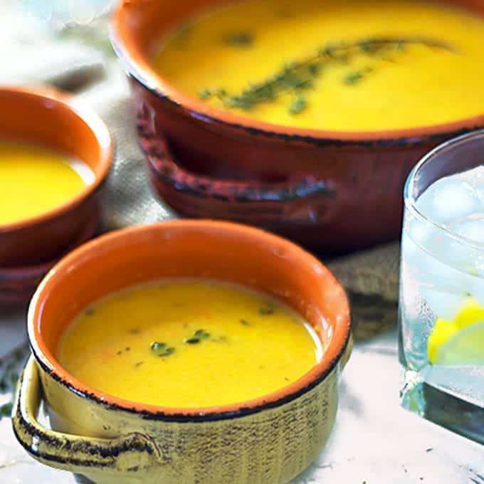 Three bowls of roasted butternut squash soup.