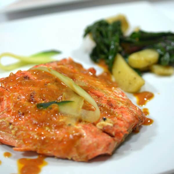 A plate of salmon and a side of blitva.