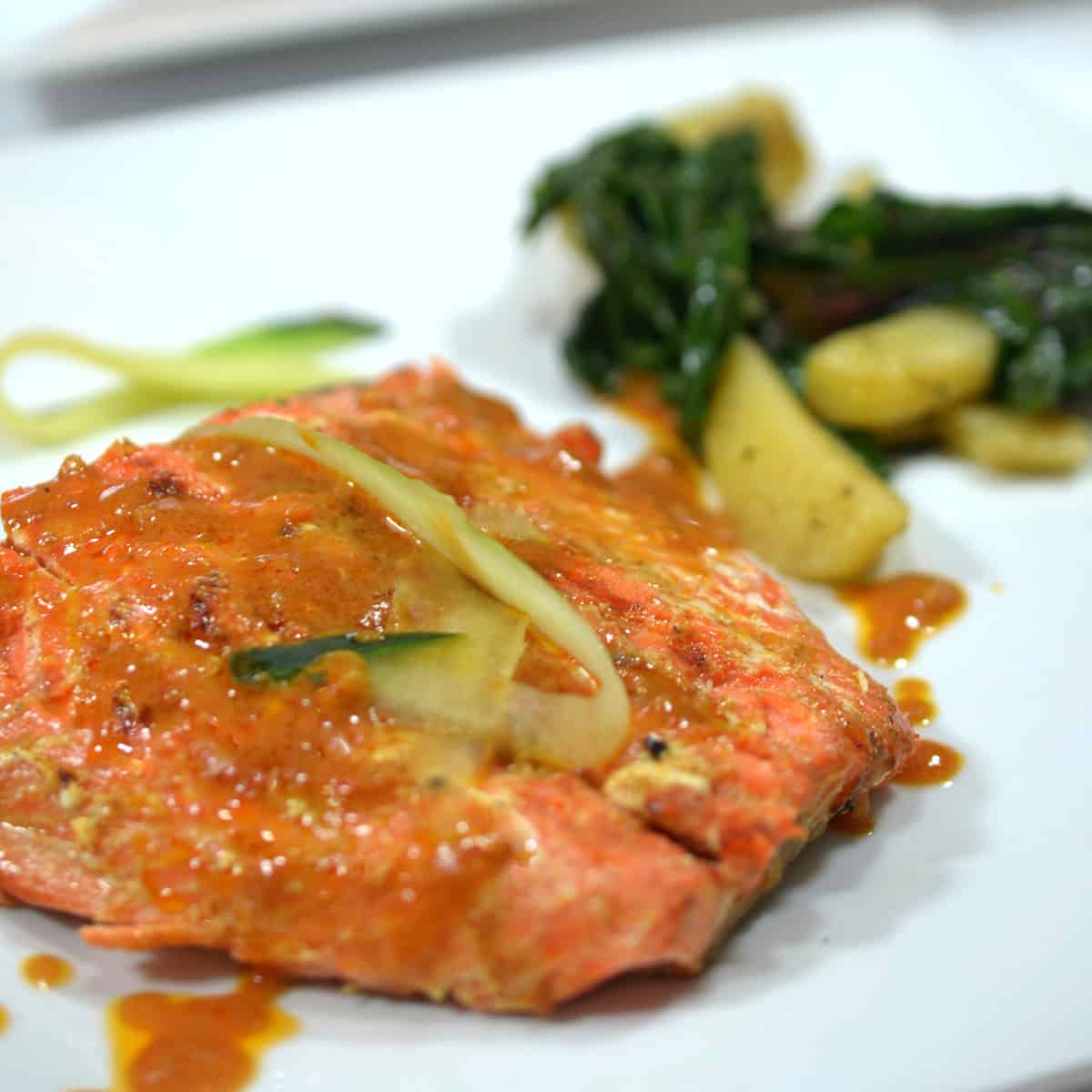 A plate of salmon and a side of blitva.