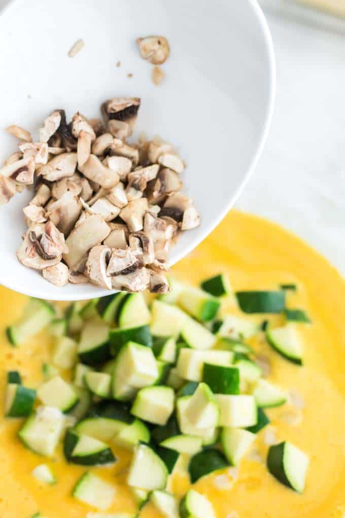 Adding vegetables in a mixing bowl