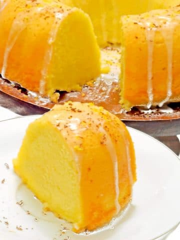 Slice of 7 up pound cake on a white plate.