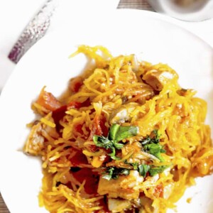 A plate of food with spaghetti squash