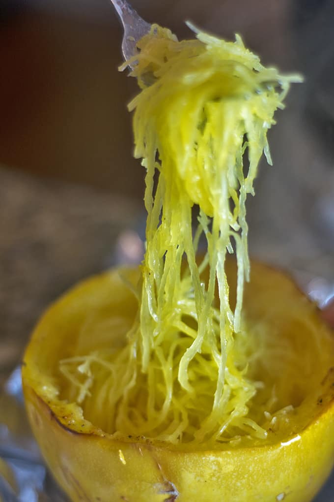 A closeup of strands of spaghetti squash