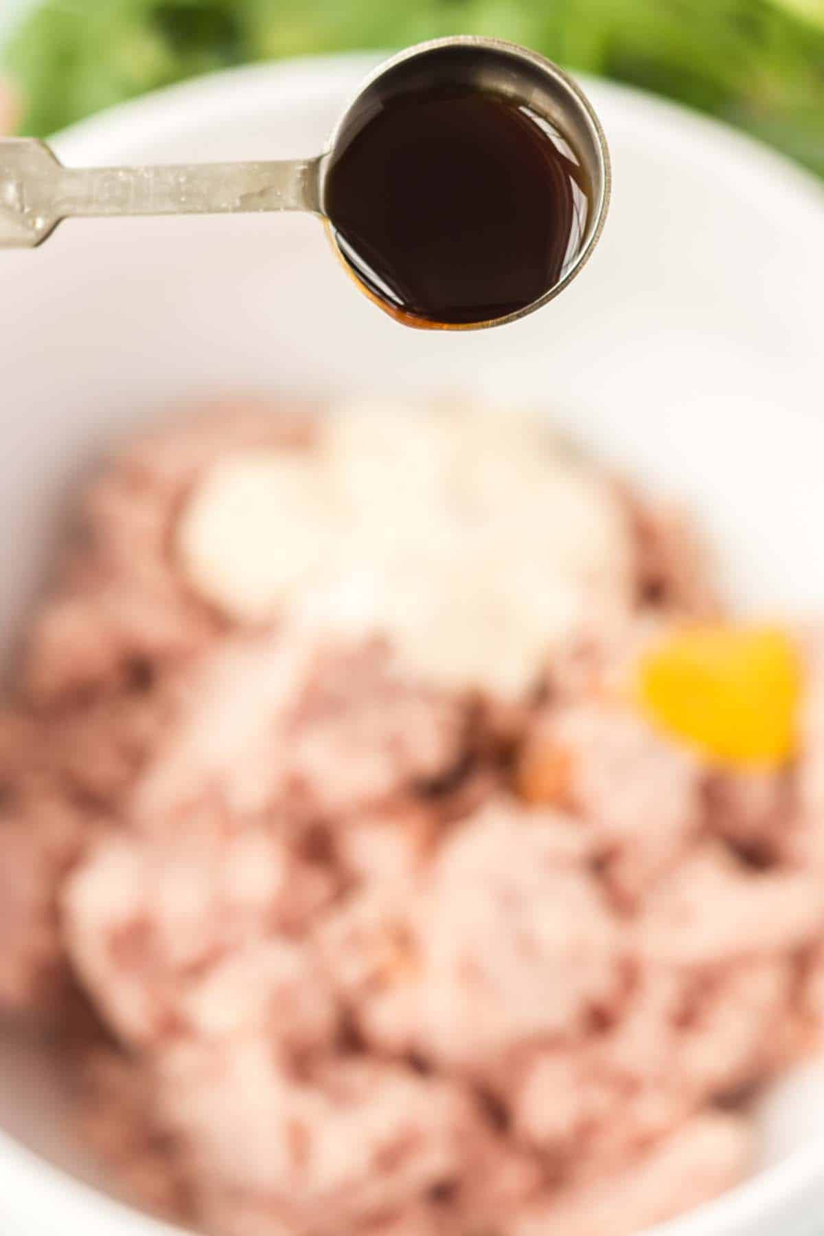 Adding Worcestershire sauce to some chopped up ham.