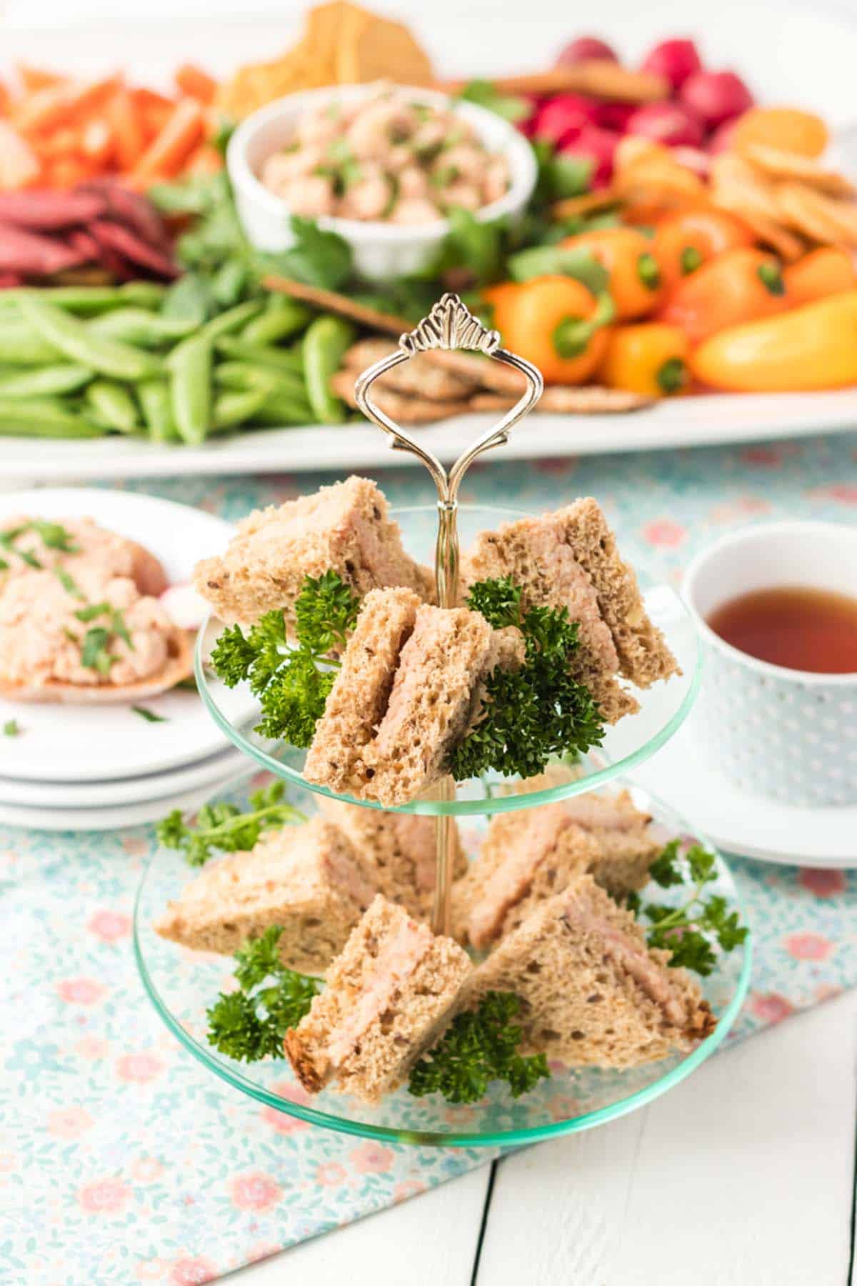 A bunch of sandwiches and vegetables.