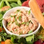 A bowl of deviled ham with vegetables.