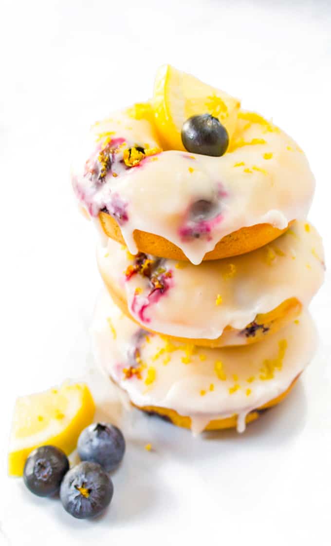 stack of blueberry donuts with lemon glaze.