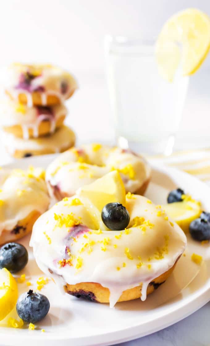 Plate of baked donuts recipe made from blueberries and lemon.