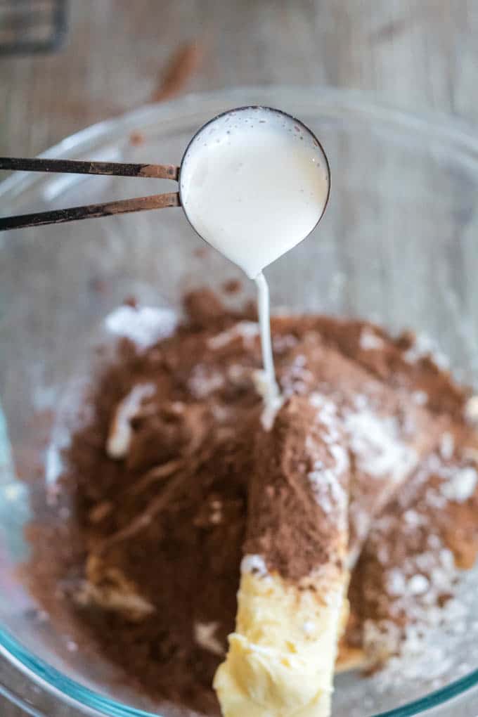 Adding heavy cream to a mixing bowl